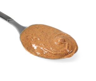 Photo of Delicious nut butter in spoon isolated on white