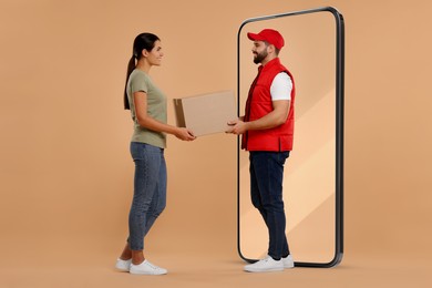 Courier giving parcel to woman near huge smartphone on dark beige background. Delivery service