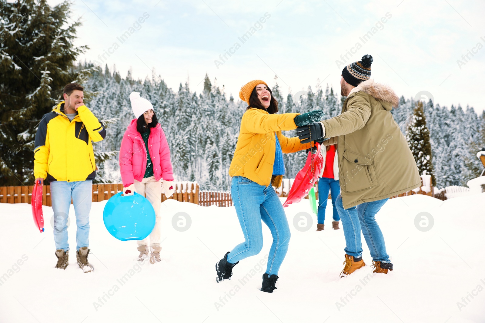 Photo of Group of friends outdoors on snowy day. Winter vacation