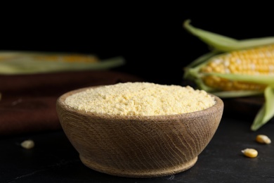 Photo of Corn flour in bowl on black table