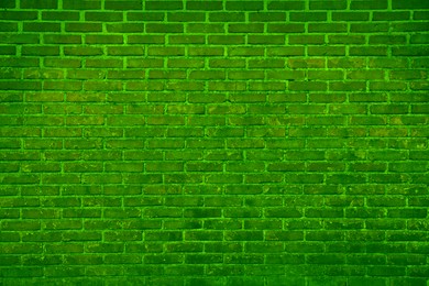 Texture of bright green brick wall as background