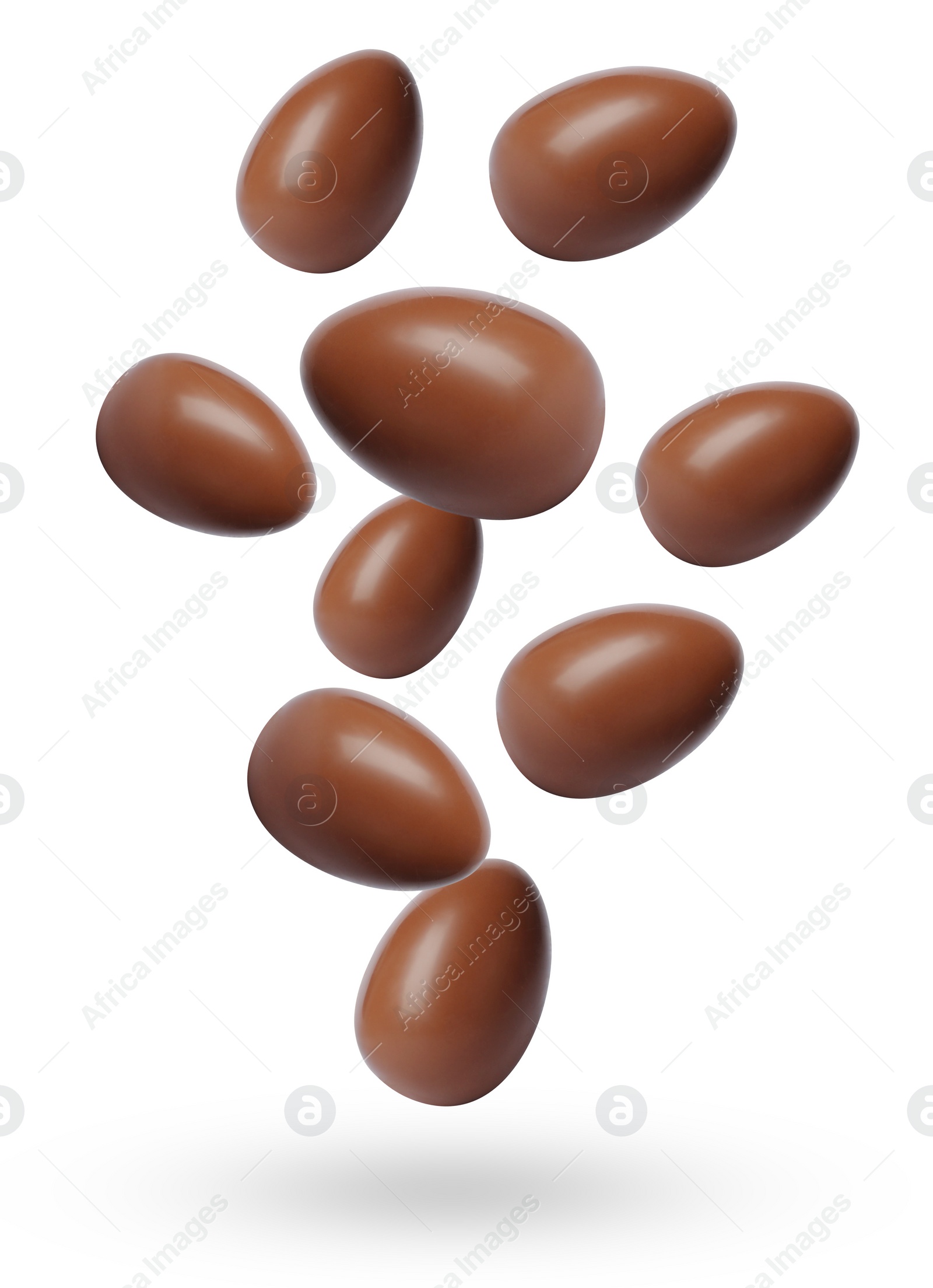 Image of Many chocolate eggs falling on white background