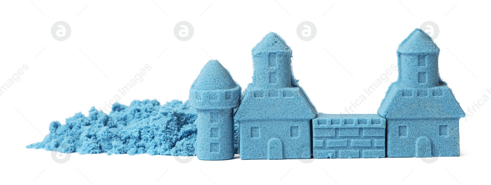 Photo of Castle made of blue kinetic sand isolated on white