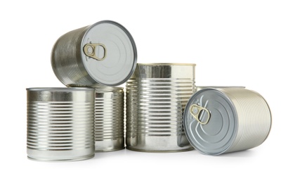 Photo of Closed tin cans isolated on white, mockup for design