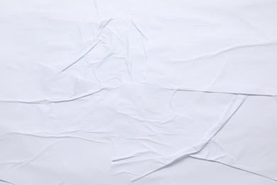 Photo of White crumpled sheet of paper as background, top view. Wall poster