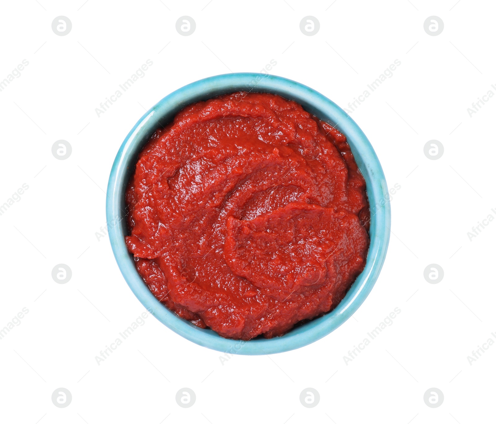 Photo of Bowl of tasty tomato paste isolated on white, top view