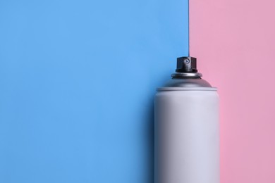 Photo of Can of graffiti spray paint on color background, top view. Space for text