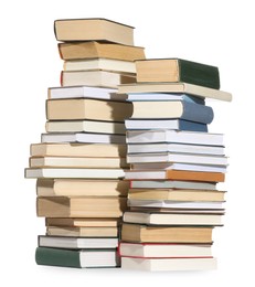 Photo of Stacks of many different books isolated on white