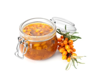 Photo of Delicious sea buckthorn jam in jar and fresh berries on white background