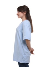 Photo of Smiling woman in stylish light blue t-shirt on white background