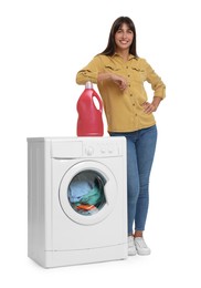Photo of Beautiful woman with detergent near washing machine on white background
