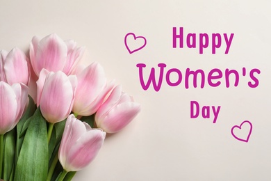 Beautiful tulips on light background, top view. Happy Women's Day