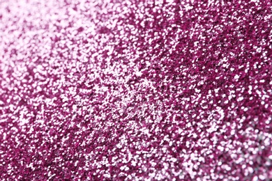 Photo of Closeup view of sparkling pink glitter background