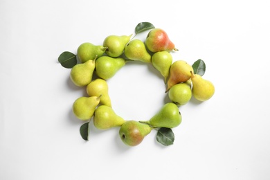 Photo of Frame made of ripe juicy pears on white background, top view