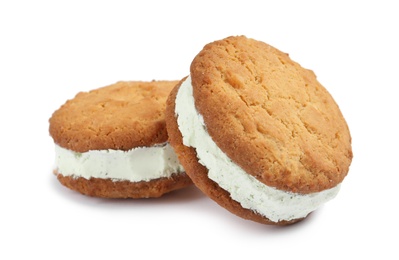 Photo of Sweet delicious ice cream cookie sandwiches on white background