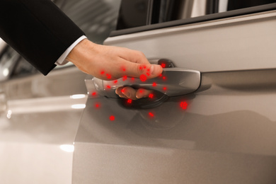 Man opening door of modern car, closeup. Virus spread 