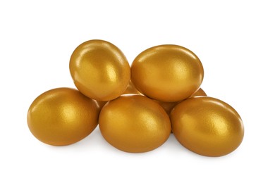 Many shiny golden eggs on white background