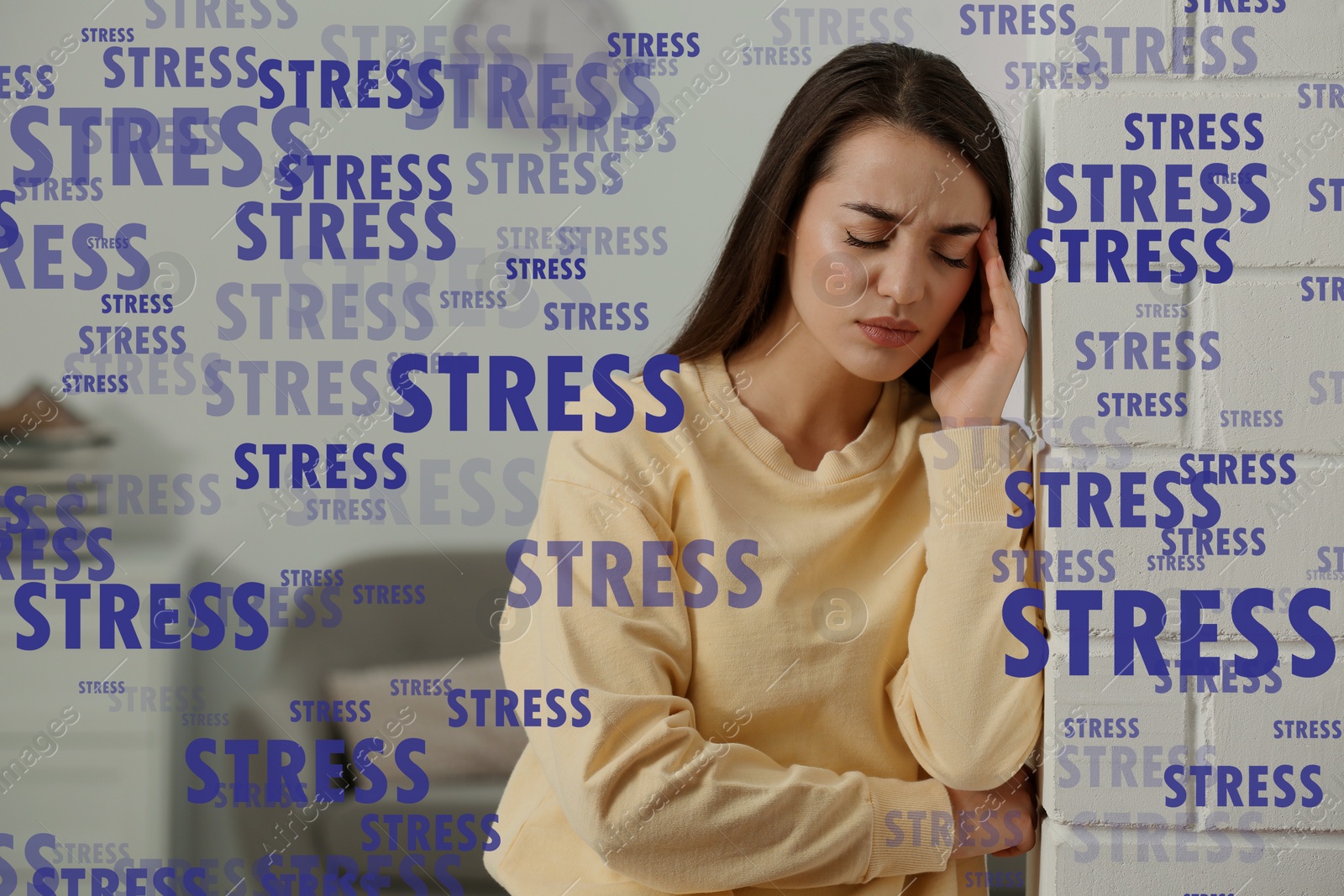 Image of Stressed young woman in room at home