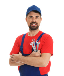 Photo of Portrait of professional auto mechanic with wrenches on white background