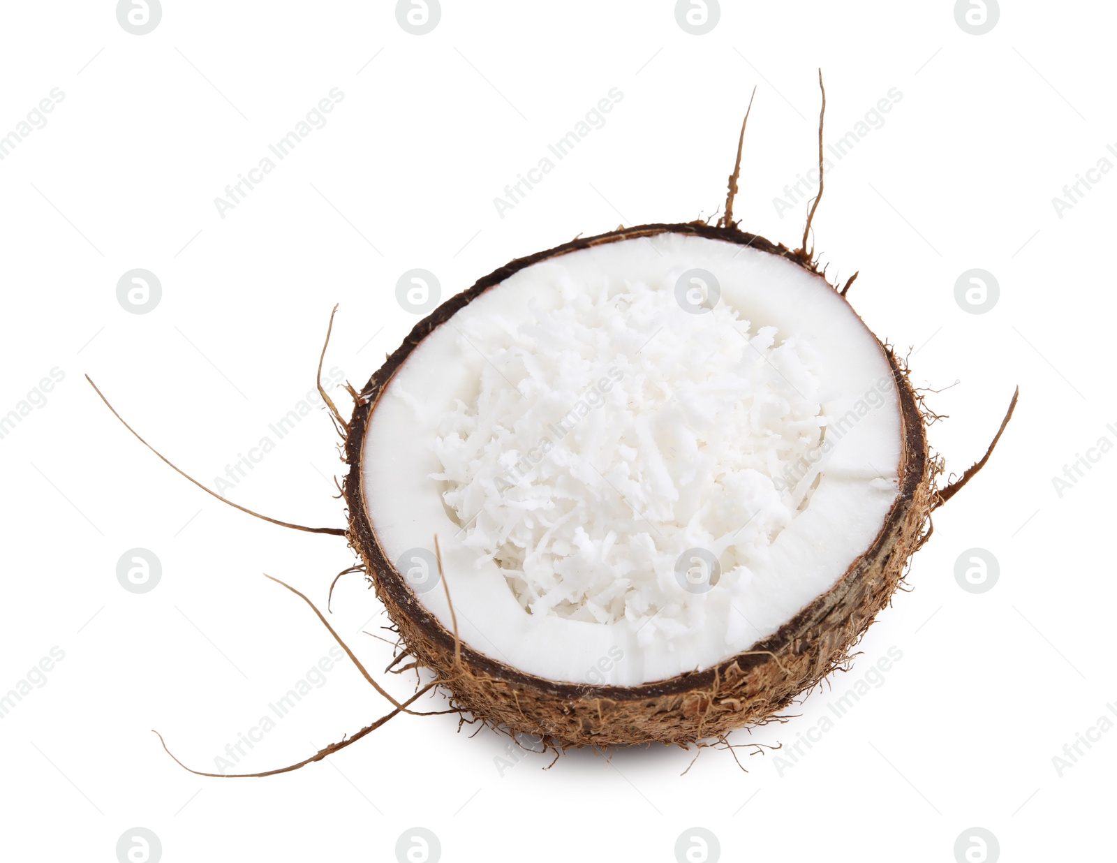 Photo of Coconut flakes in nut shell isolated on white