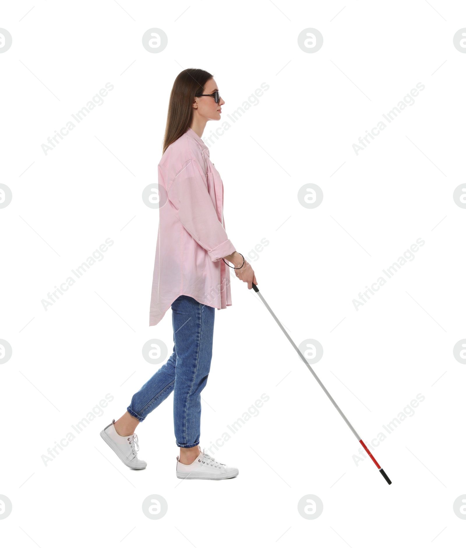 Photo of Blind woman with long cane on white background