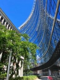 Photo of Low angle view of modern office buildings on city street