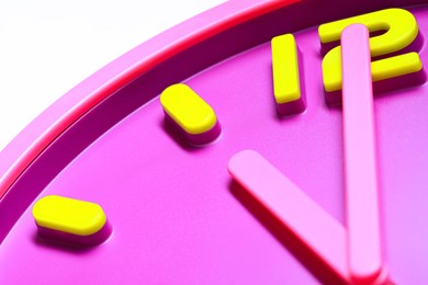 Stylish round clock on white background, closeup. Interior element