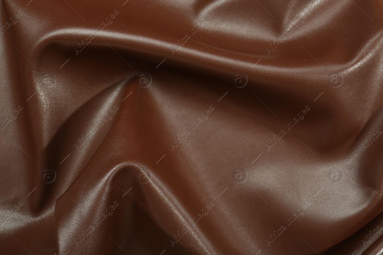 Photo of Brown natural leather as background, top view