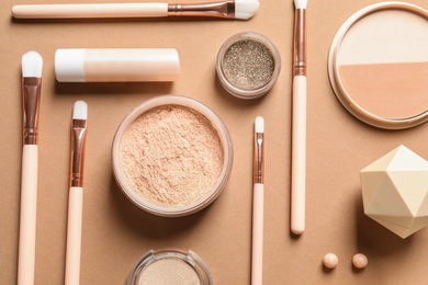 Photo of Flat lay composition with makeup brushes on brown background