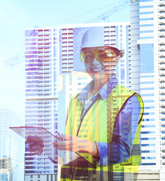 Double exposure of female industrial engineer in uniform and construction 