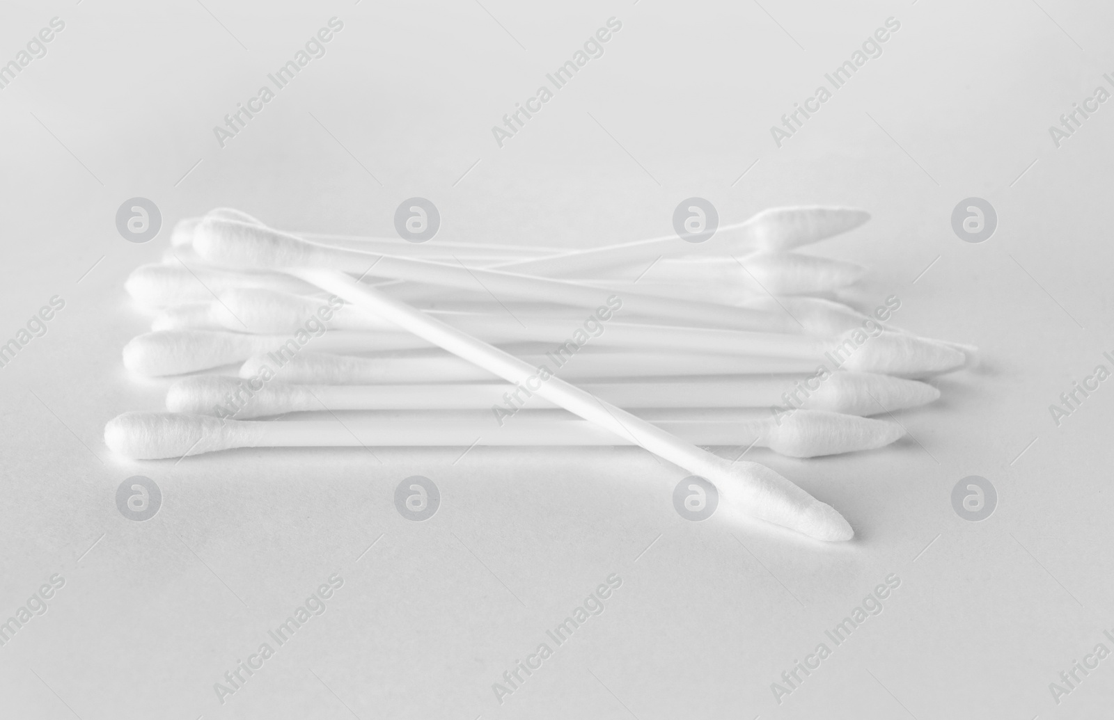 Photo of Clean cotton buds isolated on white. Hygienic product