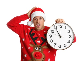 Man in Santa hat with clock on white background. New Year countdown