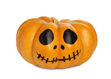 Photo of Pumpkin with drawn spooky face isolated on white. Halloween celebration