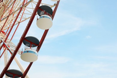 Photo of Beautiful large Ferris wheel outdoors, low angle view. Space for text
