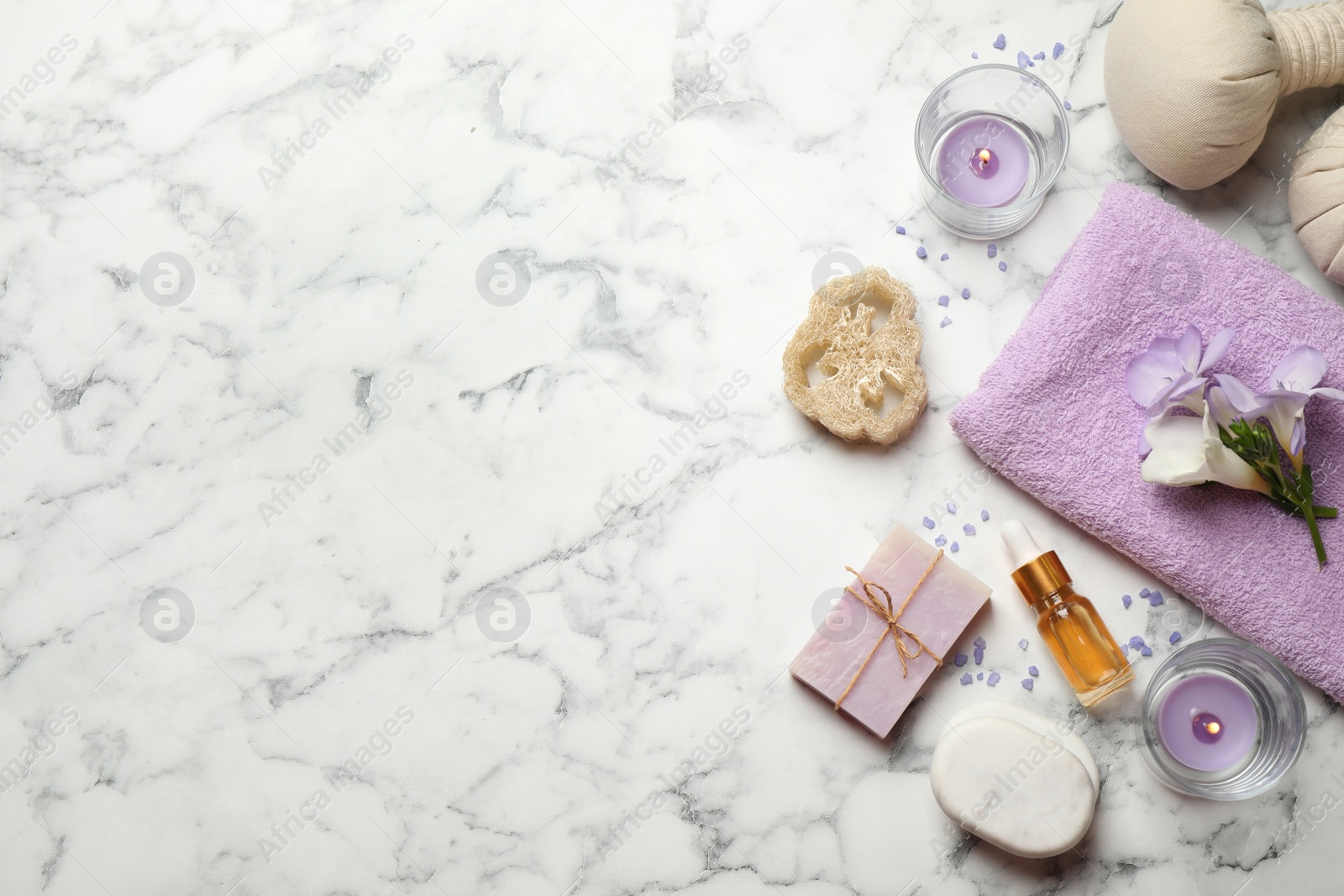 Photo of Flat lay spa composition with skin care products on white marble table, space for text