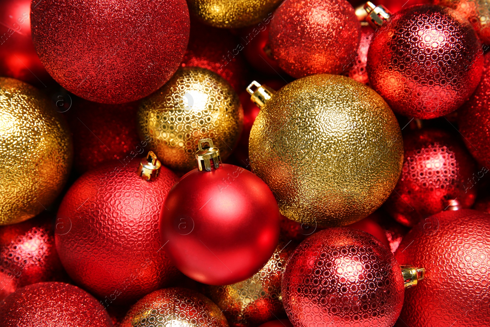 Photo of Red and golden Christmas balls as background, top view