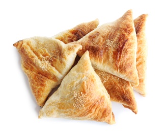 Photo of Fresh delicious puff pastry on white background, flat lay