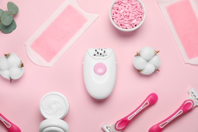 Flat lay composition with different epilation products on pink background