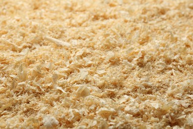 Photo of Dry natural sawdust as background, closeup view