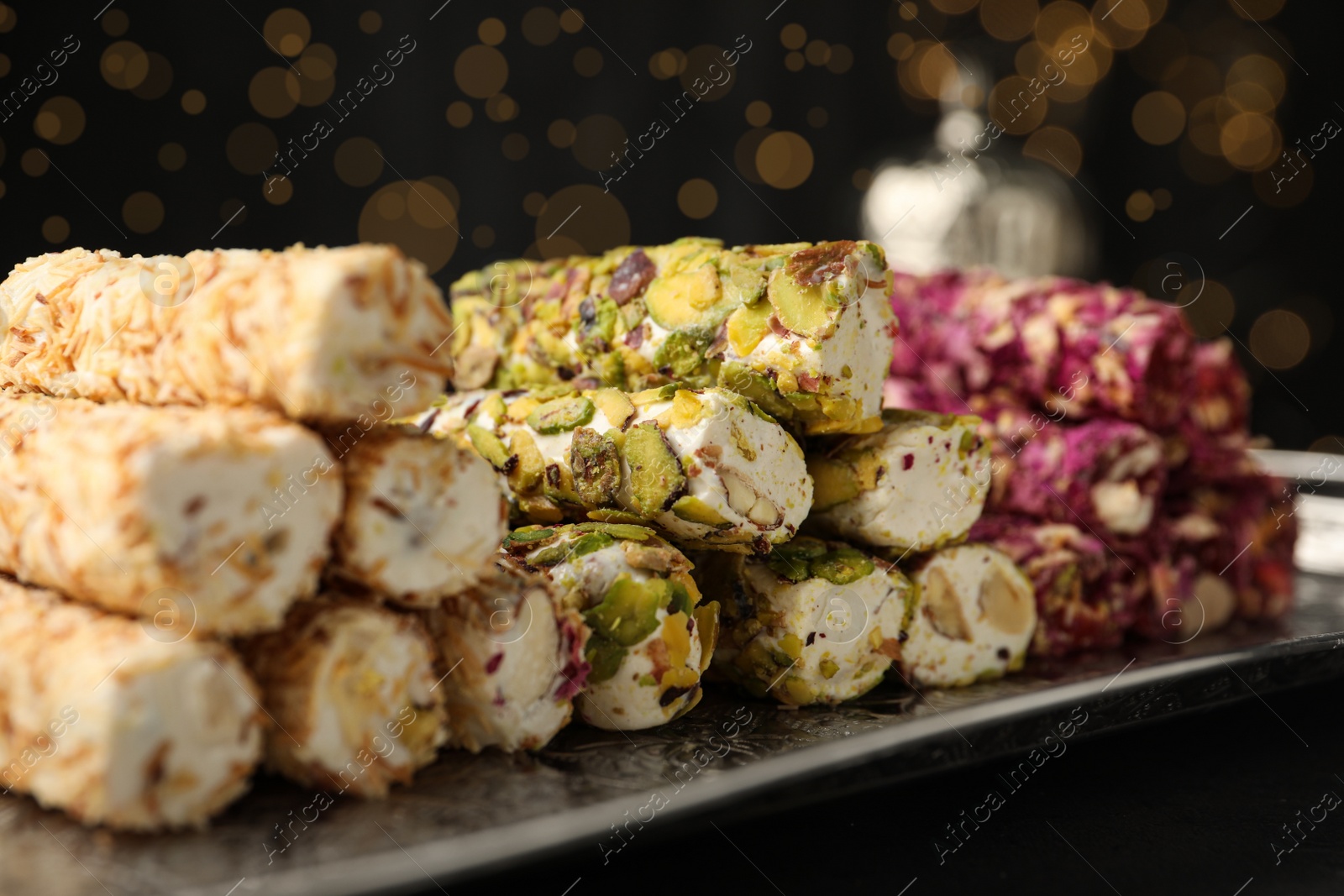 Photo of Turkish delight dessert on tray, closeup. Traditional sweet