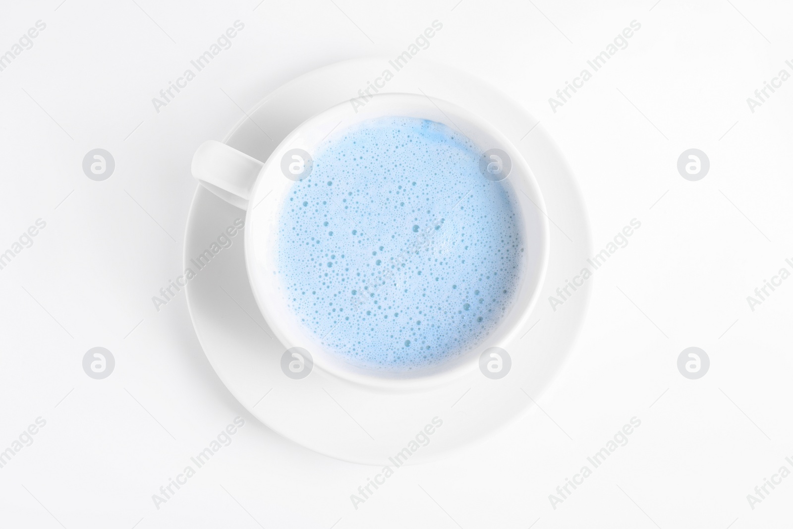 Image of Blue matcha latte in cup on white background, top view