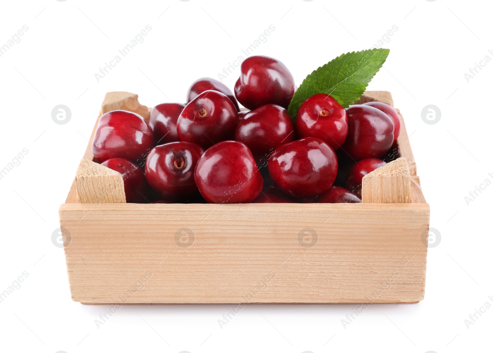 Photo of Tasty ripe red cherries in wooden crate isolated on white