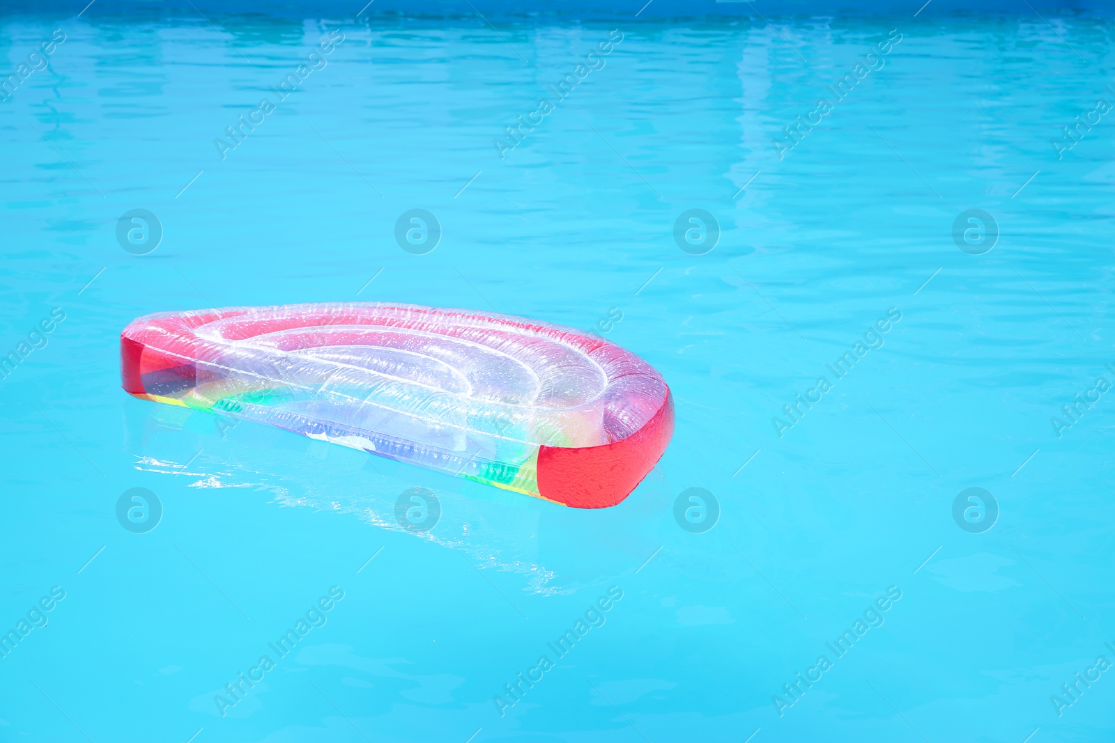 Photo of Inflatable mattress in swimming pool on sunny day