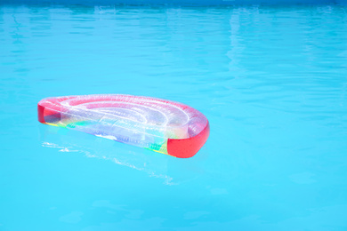 Photo of Inflatable mattress in swimming pool on sunny day