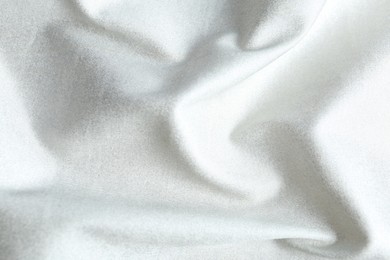 Texture of delicate white fabric as background, closeup