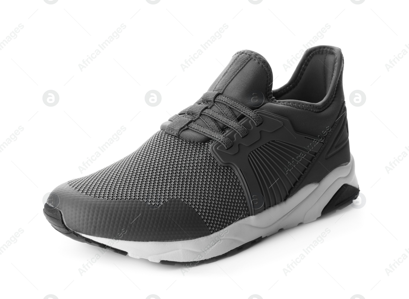 Photo of Stylish grey sports shoe isolated on white