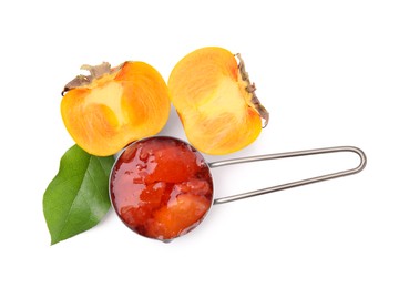 Photo of Saucepan of tasty persimmon jam and fresh fruits on white background, top view