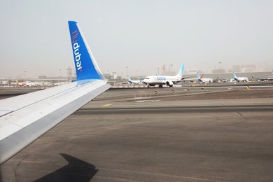 Photo of DUBAI, UNITED ARAB EMIRATES - NOVEMBER 06, 2018: View of airport landing zone from Flydubai plane