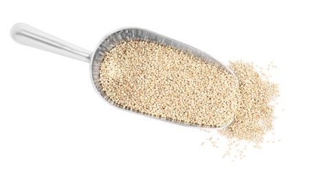 Metal scoop with quinoa on white background, top view