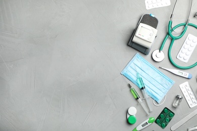Photo of Flat lay composition with medical items and space for text on gray background
